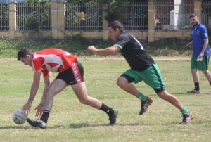 Swannies Captain Billy Crang putting the heat on Viet Celt Mark Horkan in the men's Gaelic