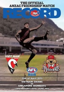 Rod Pope featuring on the 2015 Anzac Friendship Match Football Record in front of the modern day Lord Mayor's Oval Grandstand