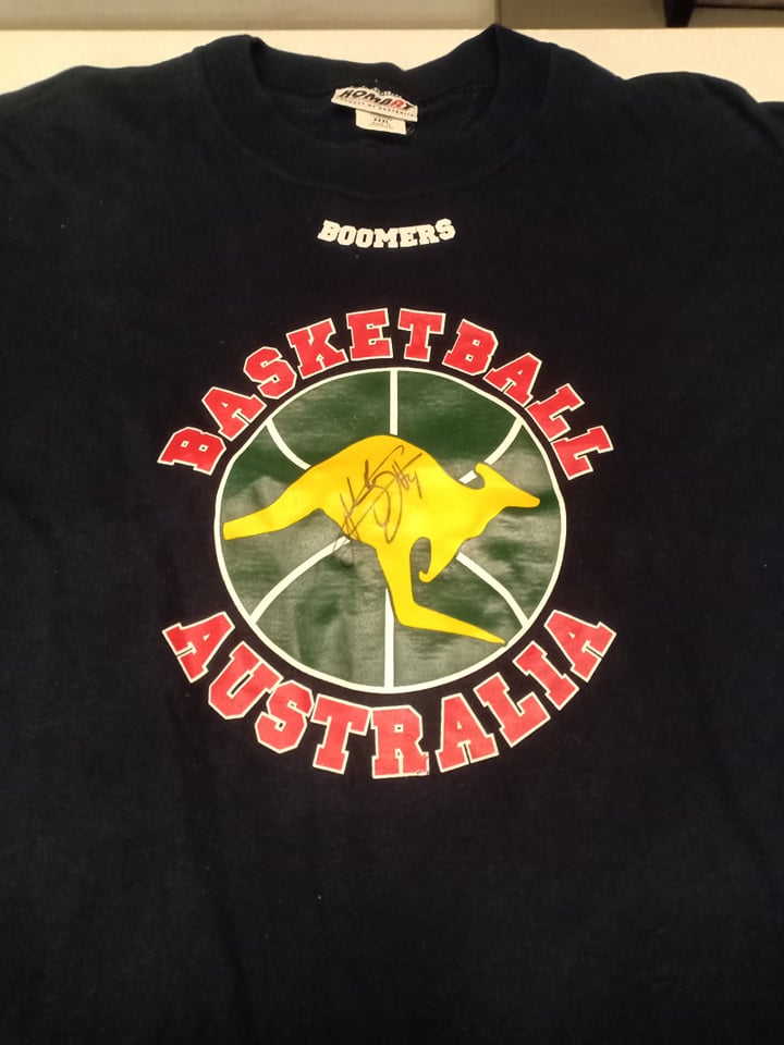 A Boomers shirt signed by Aussie Basketball legend Andrew Bogut. The 2005 NUMBER 1 NBA Draft Pick and NBA champion in 2015 with the Golden State Warriors!